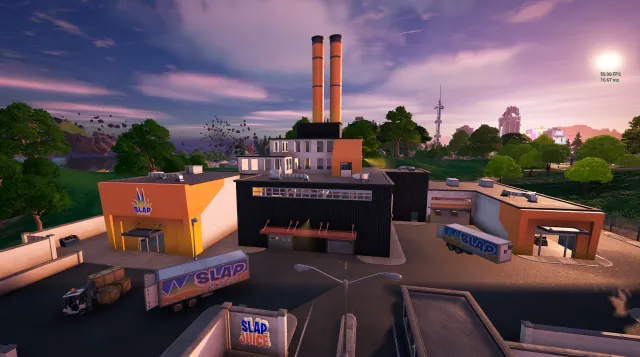 Slap Factory, en overvejende sort bygning med orange og hvid maling og to orange skorstene, der kommer ud af toppen. 