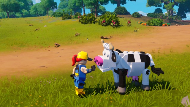 En spiller, der klapper en ko i LEGO Fortnite.